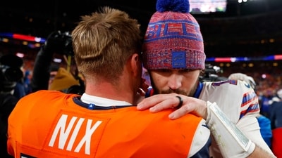 Josh Allen congratulates Bo Nix after overtime in the AFC Divisional Playoff game (Photo by Justin Edmonds / GETTY IMAGES NORTH AMERICA / Getty Images via AFP) (Getty Images via AFP)