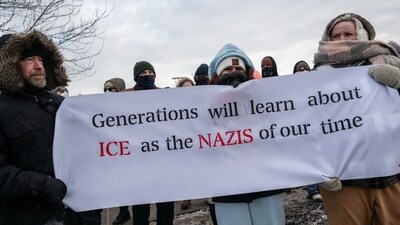 Demonstrators against the Immigration and Customs Enforcement (ICE) deployment display a sign during a protest outside the Bishop Henry Whipple Federal Building in St. Paul, Minnesota, US, on Saturday, Jan. 17, 2026. (Photographer: Victor J. Blue/Bloomberg) (Bloomberg) Demonstrators against the Immigration and Customs Enforcement (ICE) deployment display a sign during a protest outside the Bishop Henry Whipple Federal Building in St. Paul, Minnesota, US, on Saturday, Jan. 17, 2026. (Photographer: Victor J. Blue/Bloomberg) (Bloomberg)