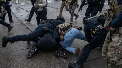 Federal law enforcement officers detain a demonstrator during a protest outside the Bishop Henry Whipple Federal Building in St. Paul, Minnesota, US, on Saturday, Jan. 17, 2026. (Photographer: Victor J. Blue/Bloomberg) (Bloomberg) Federal law enforcement officers detain a demonstrator during a protest outside the Bishop Henry Whipple Federal Building in St. Paul, Minnesota, US, on Saturday, Jan. 17, 2026. (Photographer: Victor J. Blue/Bloomberg) (Bloomberg)