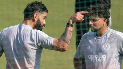 Virat Kohli, left, and Kuldeep Yadav during a training session ahead of the third ODI cricket match between India and New Zealand in Indore (PTI) Virat Kohli, left, and Kuldeep Yadav during a training session ahead of the third ODI cricket match between India and New Zealand in Indore (PTI)