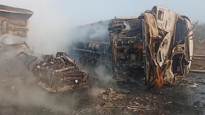The mangled remains of the truck on KMP expressway as fire officials douse one of the engulfed truck. (HT Photo) The mangled remains of the truck on KMP expressway as fire officials douse one of the engulfed truck. (HT Photo)