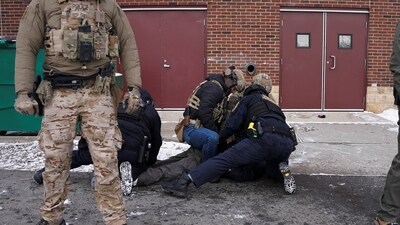 A demonstrator is detained in front of the Bishop Henry Whipple Federal Building during a protest, more than a week after a U.S. Immigration and Customs Enforcement (ICE) agent fatally shot Renee Nicole Good, in Minneapolis, Minnesota, U.S., January 17, 2026. (REUTERS/Seth Herald) (REUTERS)