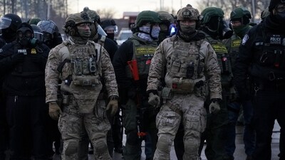 Members of U.S. Customs and Border Protection (CBP) and other law enforcement officials stand guard, in front of the Bishop Henry Whipple Federal Building, during a protest more than a week after an ICE agent fatally shot Renee Nicole Good, in Minneapolis, Minnesota, U.S., January 17, 2026. (REUTERS/Seth Herald) (REUTERS)