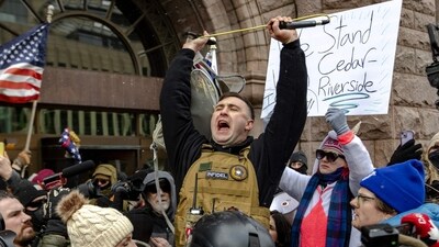 Right wing influencer Jake Lang is confronted by protesters at a rally near city hall on January 17, 2026 in Minneapolis, Minnesota. (Photo by Jim Vondruska / GETTY IMAGES NORTH AMERICA / Getty Images via AFP) (Getty Images via AFP) Right wing influencer Jake Lang is confronted by protesters at a rally near city hall on January 17, 2026 in Minneapolis, Minnesota. (Photo by Jim Vondruska / GETTY IMAGES NORTH AMERICA / Getty Images via AFP) (Getty Images via AFP)
