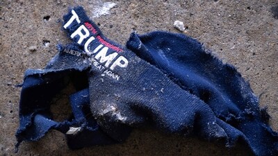 A hat that was carried by a suspected white nationalist demonstrator sits on the ground after he clashed with immigrant rights protesters on January 17, 2026 in Minneapolis, Minnesota. (Photo by SCOTT OLSON / GETTY IMAGES NORTH AMERICA / Getty Images via AFP) (Getty Images via AFP) A hat that was carried by a suspected white nationalist demonstrator sits on the ground after he clashed with immigrant rights protesters on January 17, 2026 in Minneapolis, Minnesota. (Photo by SCOTT OLSON / GETTY IMAGES NORTH AMERICA / Getty Images via AFP) (Getty Images via AFP)