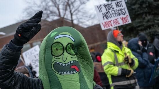 A demonstrator against the Immigration and Customs Enforcement (ICE) deployment in a costume during a protest outside the Bishop Henry Whipple Federal Building in St. Paul, Minnesota, US, on Saturday, Jan. 17, 2026. (Photographer: Victor J. Blue/Bloomberg)(Bloomberg)