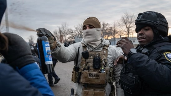 Federal law enforcement officers use pepper spray against a demonstrator during a protest outside the Bishop Henry Whipple Federal Building in St. Paul, Minnesota, US, on Saturday, Jan. 17, 2026. (Photographer: Victor J. Blue/Bloomberg)(Bloomberg)