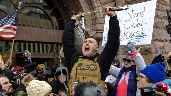 Right wing influencer Jake Lang is confronted by protesters at a rally near city hall on January 17, 2026 in Minneapolis, Minnesota. (Photo by Jim Vondruska / GETTY IMAGES NORTH AMERICA / Getty Images via AFP)(Getty Images via AFP)