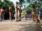 Police officers stand at the crime scene next to markings of the gunshots where Nationalist Congress Party (NCP) politician Baba Siddique was shot dead in Mumbai, India, October 13, 2024.