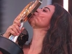 Bigg Boss Tamil 9 winner: Divya Ganesh kissing her hard earned trophy on Vijay Sethupathi-hosted show. Bigg Boss Tamil 9 winner: Divya Ganesh kissing her hard earned trophy on Vijay Sethupathi-hosted show.
