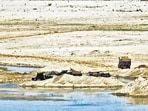 Madhya Pradesh, India - April 22, 2019: Tractor-trolleys at the the site of illegal sand mining along the banks of Chambal river, in Morena district of Madhya Pradesh, India, on Monday, April 22, 2019. (Photo by Burhaan Kinu/ Hindustan Times) (Burhaan Kinu/HT PHOTO)
