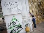 Youth surge reshapes Nepal polls as parties project younger PM faces. A member of the army removes graffiti from the main entrance of Singha Durbar office complex in Kathmandu, Nepal September 12, 2025.