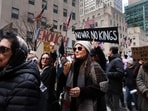 Thousands of people participate in a No Kings protest against the policies, both foreign and domestic, of the Trump administration in Manhattan on January 11, 2026 in New York City.
