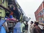Police personnel inspect the site after a collision between a bus and truck due to fog in Mainpuri on Sunday. (ANI Video Grab) Police personnel inspect the site after a collision between a bus and truck due to fog in Mainpuri on Sunday. (ANI Video Grab)