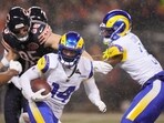 Los Angeles Rams cornerback Cobie Durant returns a ball after intercepting a pass by Chicago Bears quarterback Caleb Williams, not visible, during the first half of an NFL football divisional playoff game Sunday, Jan. 18, 2026, in Chicago. Los Angeles Rams cornerback Cobie Durant returns a ball after intercepting a pass by Chicago Bears quarterback Caleb Williams, not visible, during the first half of an NFL football divisional playoff game Sunday, Jan. 18, 2026, in Chicago.