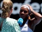 Coco Gauff (R) speaks to the media after defeating Uzbekistan's Kamilla Rakhimova.