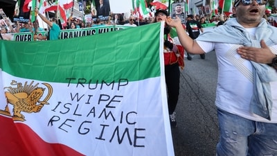 People marching in support of nationwide protests in Iran in Los Angeles on January 18, 2026, hold a sign that reads, ‘TRUMP WIPE ISLAMIC REGIME’. REUTERS/Jill Connelly (REUTERS)