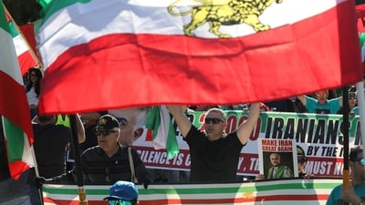 People march in support of nationwide protests in Iran, Los Angeles, California, with a banner at the back noting that several Iranians have been killed. REUTERS/Jill Connelly (REUTERS)