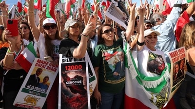 People hold signs as they march in solidarity with the people of Iran in Los Angeles, California, U.S. January 18, 2026. REUTERS/Jill Connelly (REUTERS)