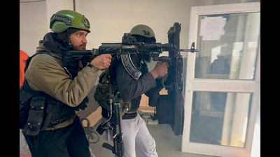 Security personnel during a joint mock drill at Qazigund railway station in Anantnag on Monday (PTI)
