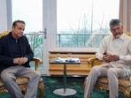 Andhra Pradesh chief minister N Chandrababu Naidu with Eros Innovations chairman Kishore Lulla in Zurich on Monday. (ANI)