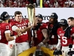 Fernando Mendoza #15 of the Indiana Hoosiers celebrates with the College Football Playoff National Championship Trophy after defeating Miami Hurricanes, at Hard Rock Stadium in Miami Gardens, Florida.   