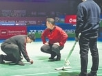 Maintenance staff clean 'bird droppings' during an India Open game in New Delhi. (PTI) Maintenance staff clean 'bird droppings' during an India Open game in New Delhi. (PTI)