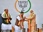 Prime Minister Narendra Modi felicitates newly elected BJP National President Nitin Nabin as the latter takes charge at party headquarters, in New Delhi.