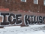 Graffiti reading "ICE kills" lines a building exterior, nearly two weeks after a U.S. Immigration and Customs Enforcement (ICE) agent fatally shot Renee Nicole Good on January 7, in Minneapolis, Minnesota, U.S., January 19, 2026. REUTERS/Tim Evans