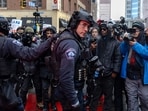 MINNEAPOLIS, MINNESOTA - JANUARY 17: Minneapolis police officers in tactical gear stand on the street in downtown Minneapolis as protesters gather on January 17, 2026 in Minneapolis, Minnesota (Photo by Jim Vondruska / GETTY IMAGES NORTH AMERICA / Getty Images via AFP)