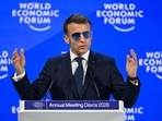 France's President Emmanuel Macron gestures as he delivers a speech during the World Economic Forum (WEF)