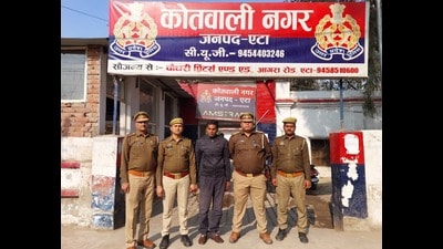 Kamal Singh in police custody in Etah Kamal Singh in police custody in Etah