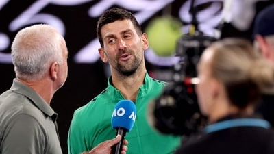 Novak Djokovic speaks to media after winning the men's singles match against Pedro Martinez on day two of the Australian Open tournament in Melbourne (AFP)