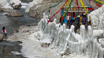 Tourists near frozen Lingti Waterfall at Spiti Valley, in Himachal on Tuesday. (PTI) Tourists near frozen Lingti Waterfall at Spiti Valley, in Himachal on Tuesday. (PTI)
