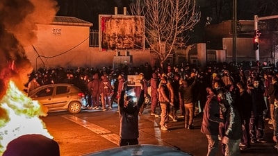 Iranian protesters block a street in Tehran.