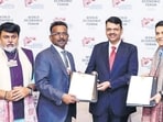 Chief minister Devendra Fadnavis signed a  <span class='webrupee'>₹</span>1 lakh-crore MoU with Abhishek Lodha, CEO of the Lodha Group, in presence of industries minister Uday Samant and industries secretary P Anbalagan. (X/CMO)
