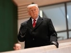 President Donald Trump walks down the stairs after a meeting during the Annual Meeting of the World Economic Forum in Davos