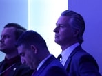 California Governor Gavin Newsom listens as President Donald Trump speaks during the 56th annual World Economic Forum (WEF) 