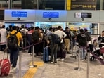 Travelers are urged to arrive early due to heightened security measures and longer processing times.
