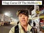 A moment from the viral Instagram reel, with 137k views so far, where the US vlogger living in Delhi reveals his obsession for momo!