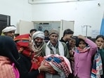 Surender Valmiki with his newborn son in Uchana on Tuesday (HT)