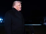 US President Donald Trump talks to the press as he walks to board Marine One at the White House in Washington, DC, on his way to Davos.