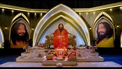 A lifesize cutout of Ashutosh Maharaj occupies the main chair at the satsang hall, signalling that he remains the functional head. (HT) A lifesize cutout of Ashutosh Maharaj occupies the main chair at the satsang hall, signalling that he remains the functional head. (HT)
