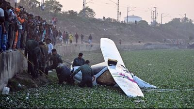 An IAF microlite aircraft being pulled out of a water body in Prayagraj on Wednesday. (HT) An IAF microlite aircraft being pulled out of a water body in Prayagraj on Wednesday. (HT)