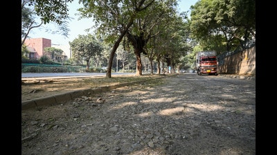 An internal road of Nirvana Country in dilapidated condition near The South Close Society on Tuesday. (Parveen Kumar/HT) An internal road of Nirvana Country in dilapidated condition near The South Close Society on Tuesday. (Parveen Kumar/HT)