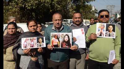 Family members holding photographs of their missing kin during a protest in Jammu on Wednesday. (HT Photo) Family members holding photographs of their missing kin during a protest in Jammu on Wednesday. (HT Photo)