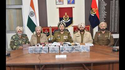 Police officials addressing mediapersons in Amritsar on Wednesday.