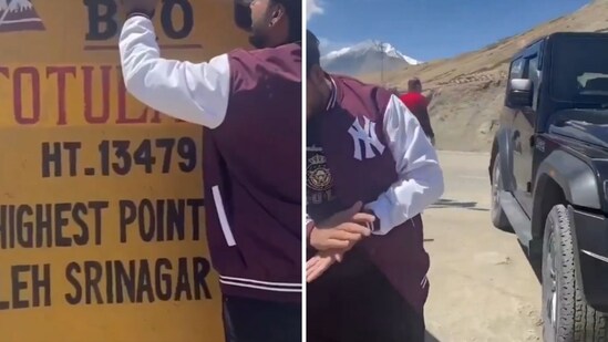 A man putting a sticker on a BRO signboard. (Screengrab (X))