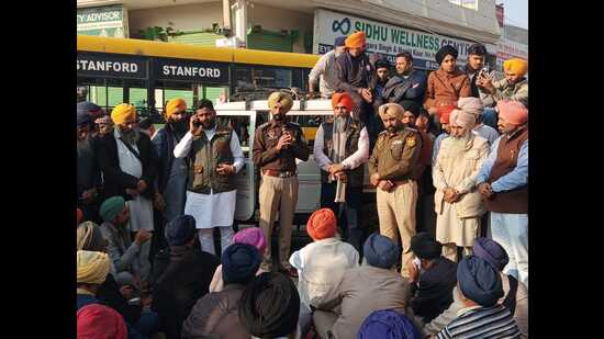 Police officials trying to pacify the protesters in Thikriwala village of Barnala on Wednesday.