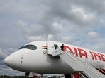 FILE PHOTO: Branding for Air India is seen on an Airbus A350-900 at the Farnborough International Airshow, in Farnborough, Britain, July 24, 2024. REUTERS/Toby Melville/File Photo